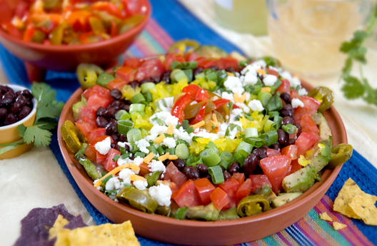 Macho Nachos: Jeff's Natural jalapeño peppers and sliced hot cherry peppers add zip to this party appetizer platter.